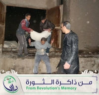 عملية تأمين الطحين من أماكن القصف الى أماكن أكثر أمناً في بداية حصار مدينة  داريا